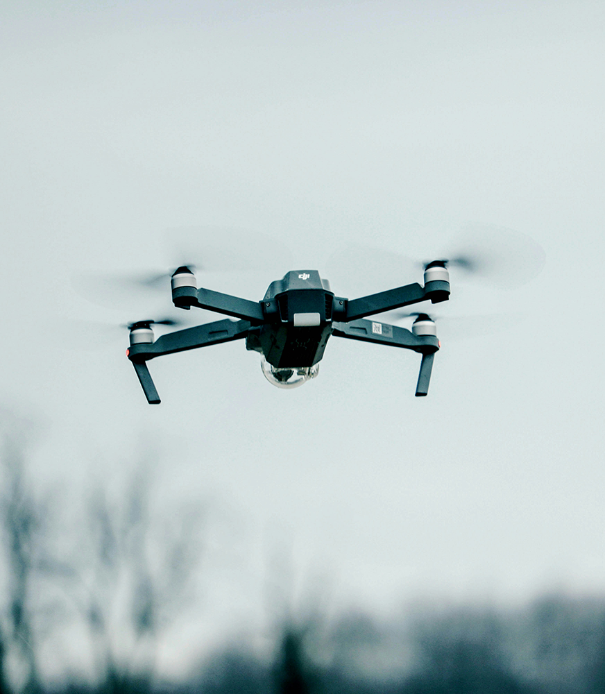 black quadcopter drone selective focus photograph